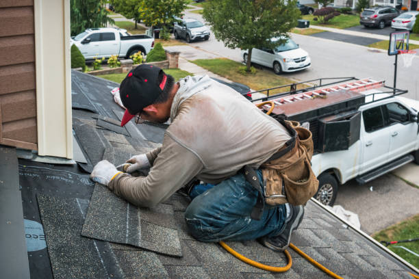 Professional Roofing technician working in Archie, MO
